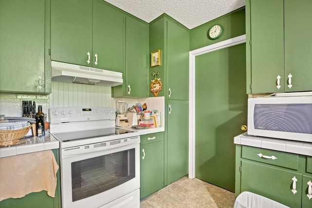 kitchen featuring green cabinetry, white appliances, light countertops, and under cabinet range hood