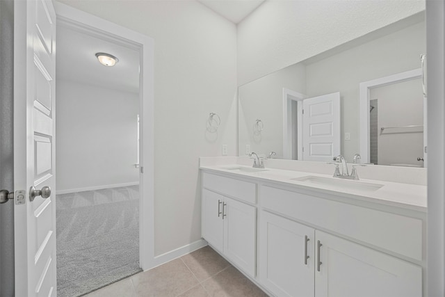 bathroom with tile patterned flooring and vanity