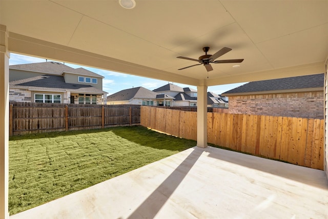 view of yard with a patio and ceiling fan