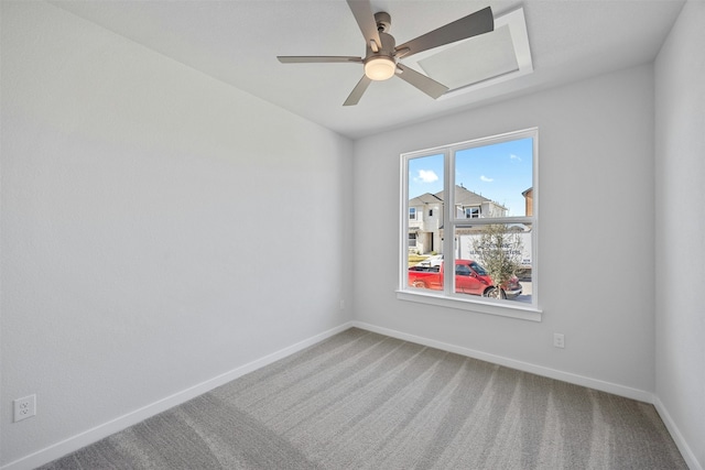 spare room with ceiling fan and carpet flooring