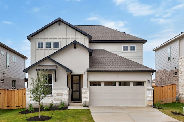 view of front of property featuring a garage and a front yard