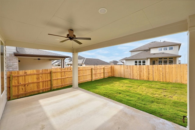 view of yard featuring a patio area and ceiling fan