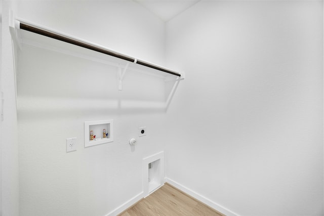 laundry area with hookup for a gas dryer, electric dryer hookup, hookup for a washing machine, and hardwood / wood-style floors