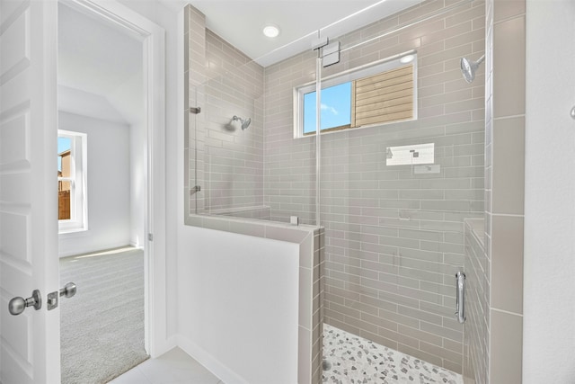 bathroom featuring walk in shower and tile patterned floors