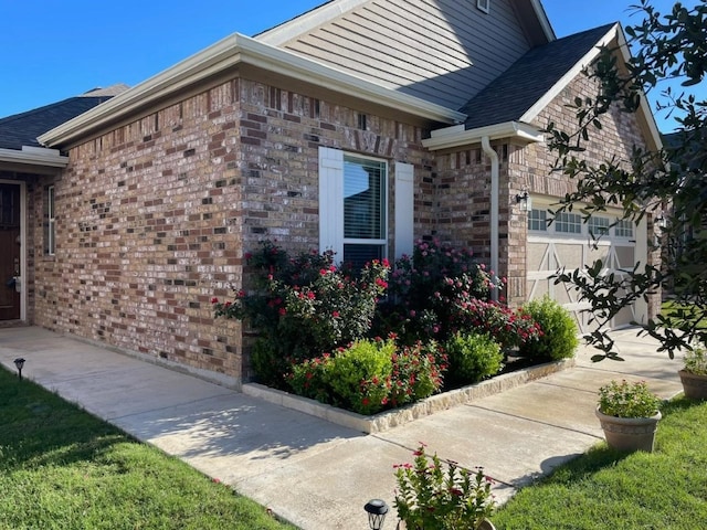 view of side of property with a garage