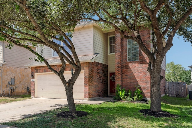 view of front of property with a garage and a front yard