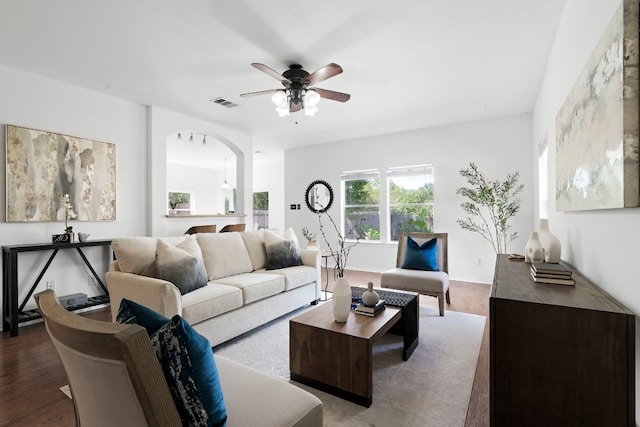 living room with hardwood / wood-style floors and ceiling fan