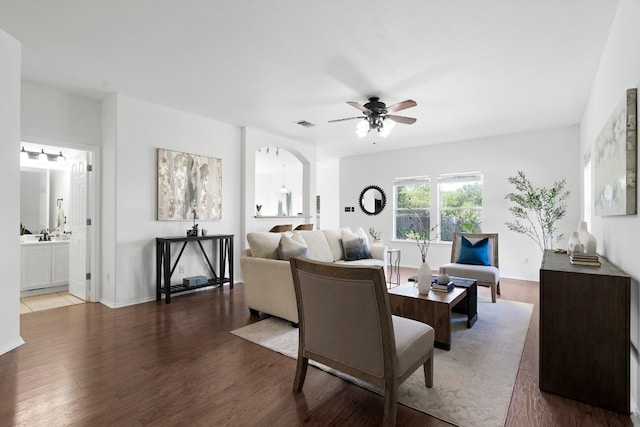 living room featuring hardwood / wood-style flooring and ceiling fan