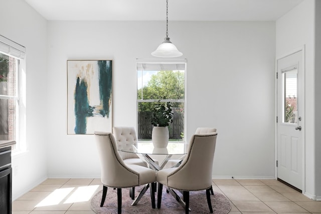 dining area with light tile patterned floors