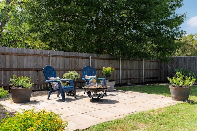 view of patio / terrace with a fire pit