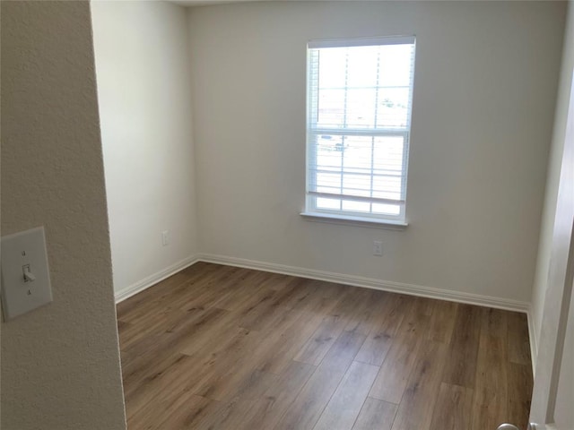 spare room with light hardwood / wood-style floors