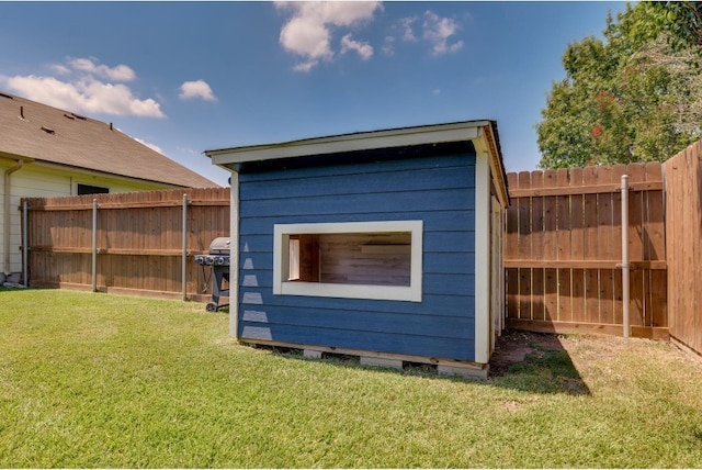 view of outdoor structure with a lawn