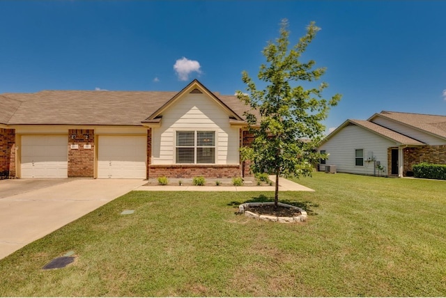 view of front of home with a garage and a front yard