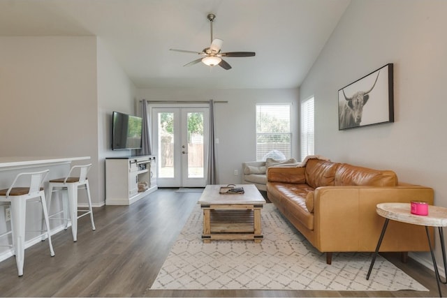 living room featuring ceiling fan, vaulted ceiling, hardwood / wood-style flooring, and french doors