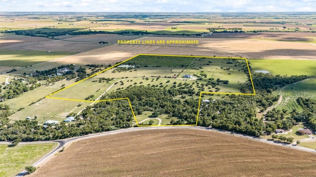 birds eye view of property featuring a rural view