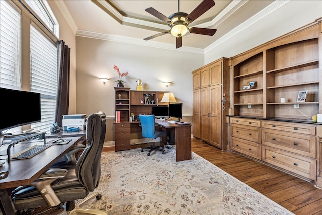 office area featuring ceiling fan, a raised ceiling, hardwood / wood-style flooring, and crown molding