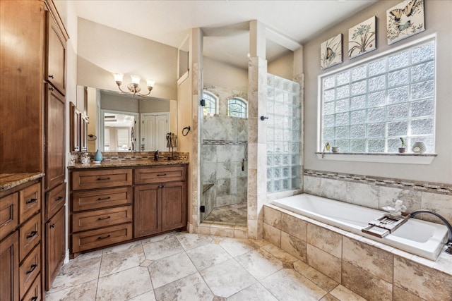 bathroom with tile patterned flooring, separate shower and tub, and vanity