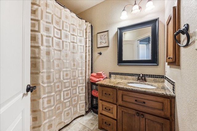 bathroom featuring tile patterned flooring and vanity