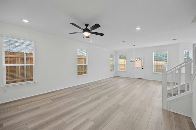7005 Taruca Ln, Austin, TX 78736 - unfurnished living room with a chandelier, light wood-style flooring, ornamental molding, a ceiling fan, and recessed lighting