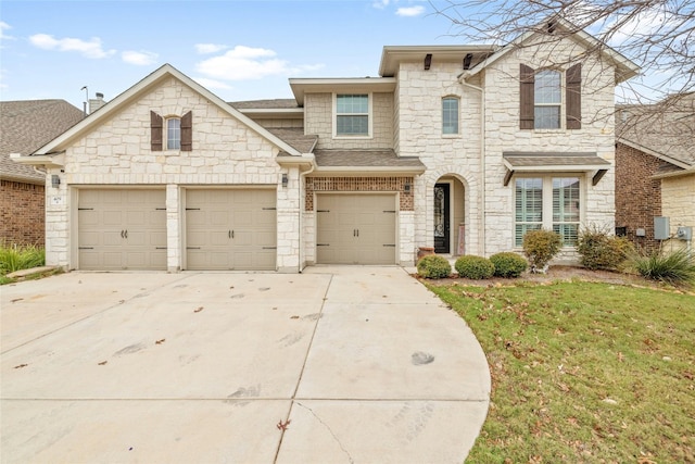 view of front of property with a garage and a front lawn