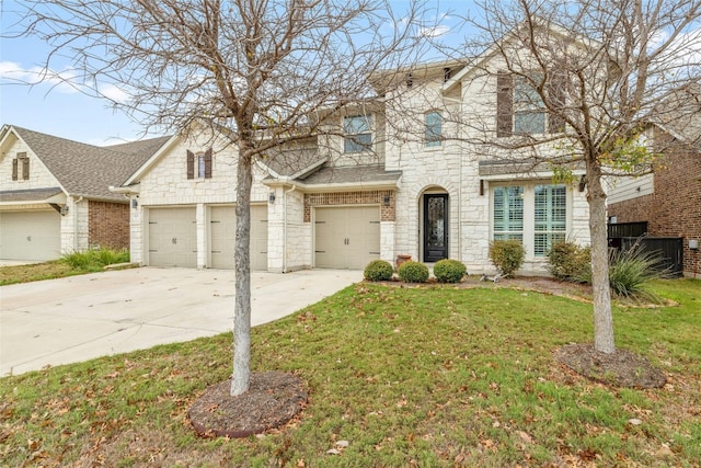 view of front of property featuring a front lawn and a garage