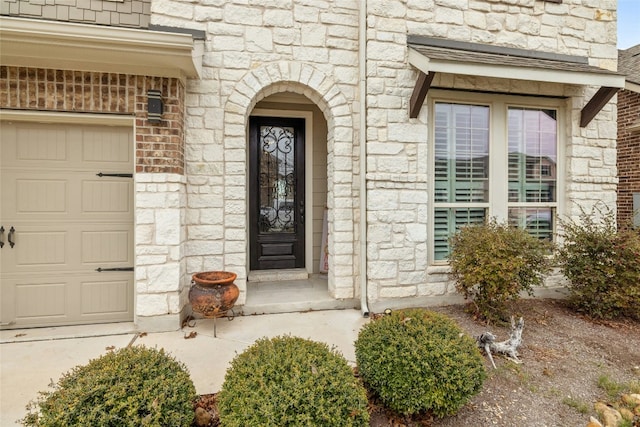 doorway to property featuring a garage