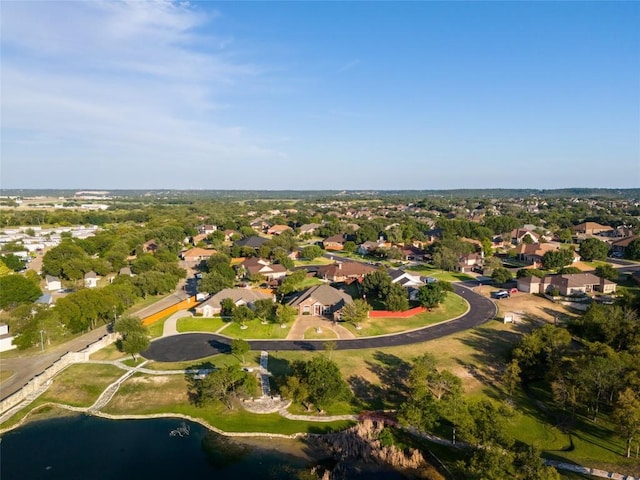 birds eye view of property with a residential view and a water view