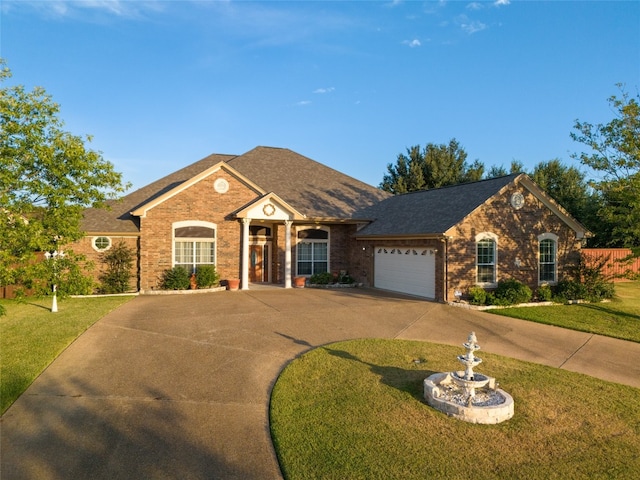 ranch-style home featuring a garage and a front lawn