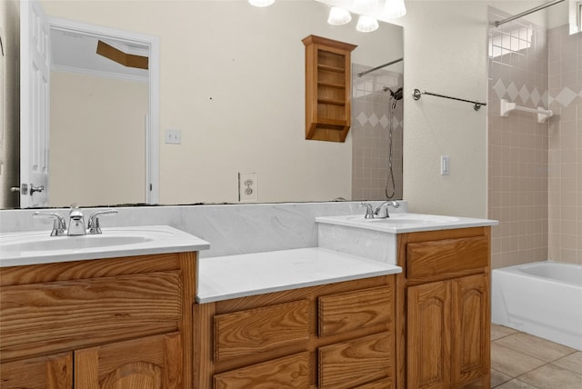 bathroom featuring tiled shower / bath combo, ornamental molding, vanity, and tile patterned floors