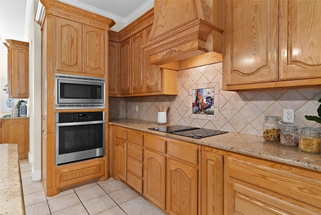 kitchen with appliances with stainless steel finishes, premium range hood, ornamental molding, tasteful backsplash, and light stone countertops