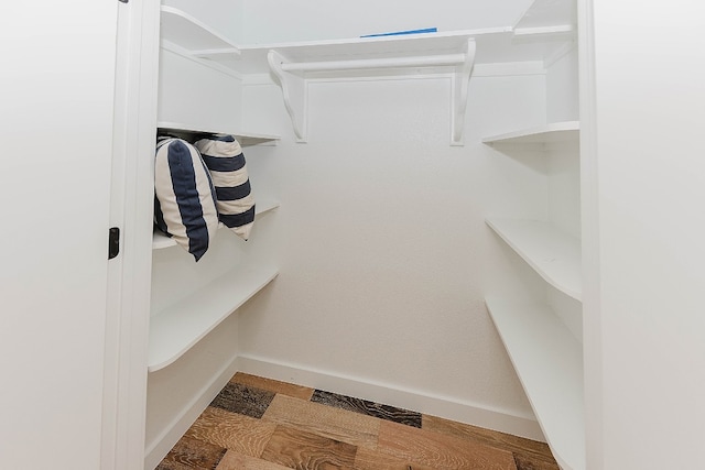 spacious closet featuring light hardwood / wood-style flooring