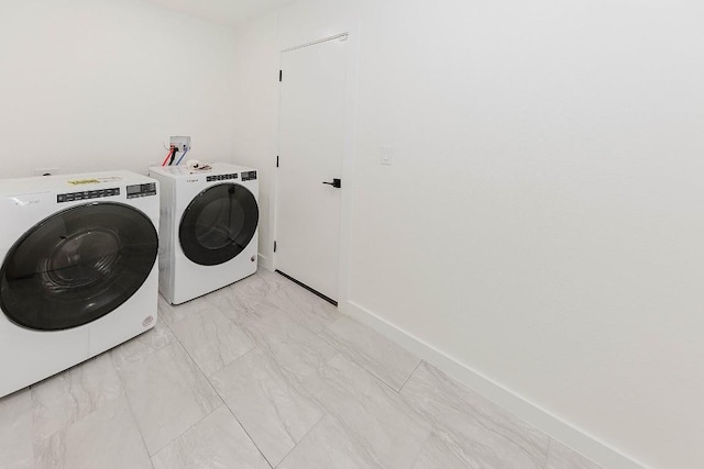 188 W Kaanapali Ln, Bastrop, TX 78602 - laundry area with separate washer and dryer, light marble finish flooring, and baseboards