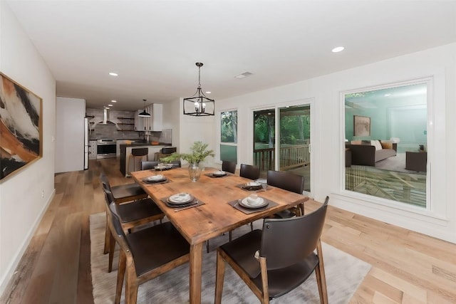 188 W Kaanapali Ln, Bastrop, TX 78602 - dining room featuring light wood-style flooring, recessed lighting, and a chandelier