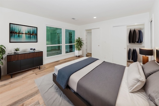 bedroom with light wood-type flooring