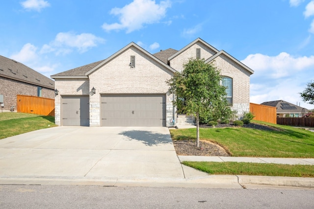 view of front facade featuring a front lawn and a garage