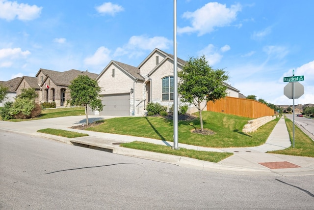 view of front of house featuring a garage and a front yard