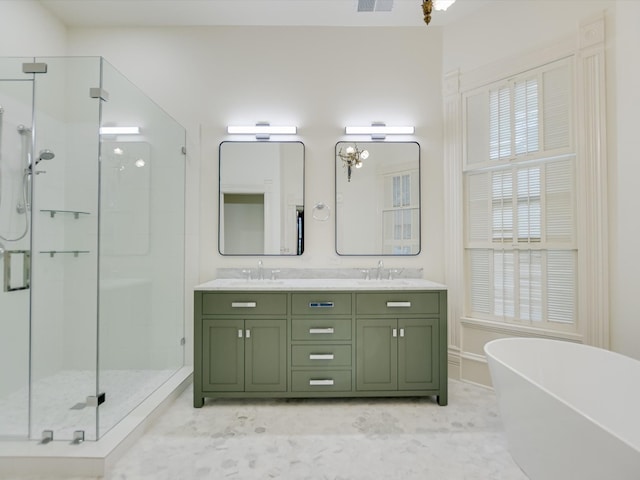 bathroom with dual vanity, plus walk in shower, and tile patterned flooring