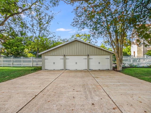 garage featuring a lawn