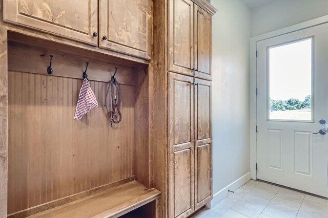 mudroom with light tile patterned floors