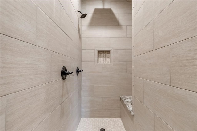 bathroom with tiled shower