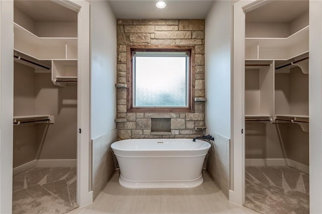 bathroom featuring a tub to relax in