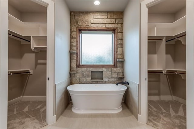 100 Gabgrove Ct, Georgetown, TX 78633 - bathroom with a spacious closet and a freestanding tub