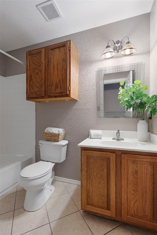 full bathroom with vanity,  shower combination, tile patterned floors, a textured ceiling, and toilet