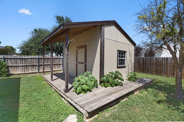 view of outdoor structure featuring a lawn