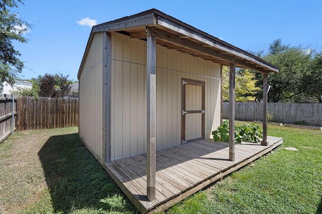 view of outdoor structure with a lawn