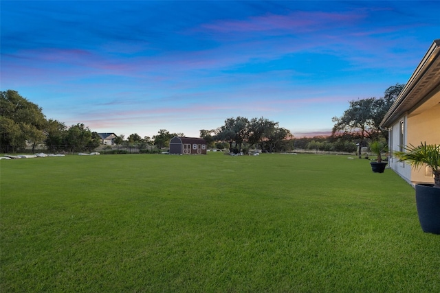 view of yard at dusk