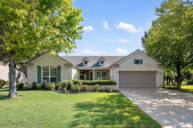 view of front of home featuring a garage and a front yard