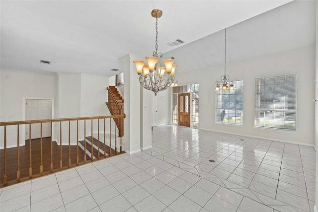 empty room featuring an inviting chandelier and light tile patterned floors