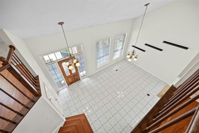 interior space featuring a chandelier and vaulted ceiling