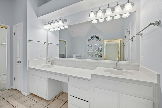 bathroom featuring vanity, lofted ceiling, tile patterned floors, and walk in shower